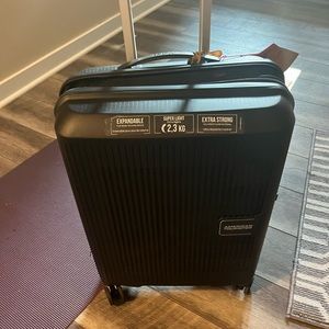 Brand new American Tourister Carry on suitcase
